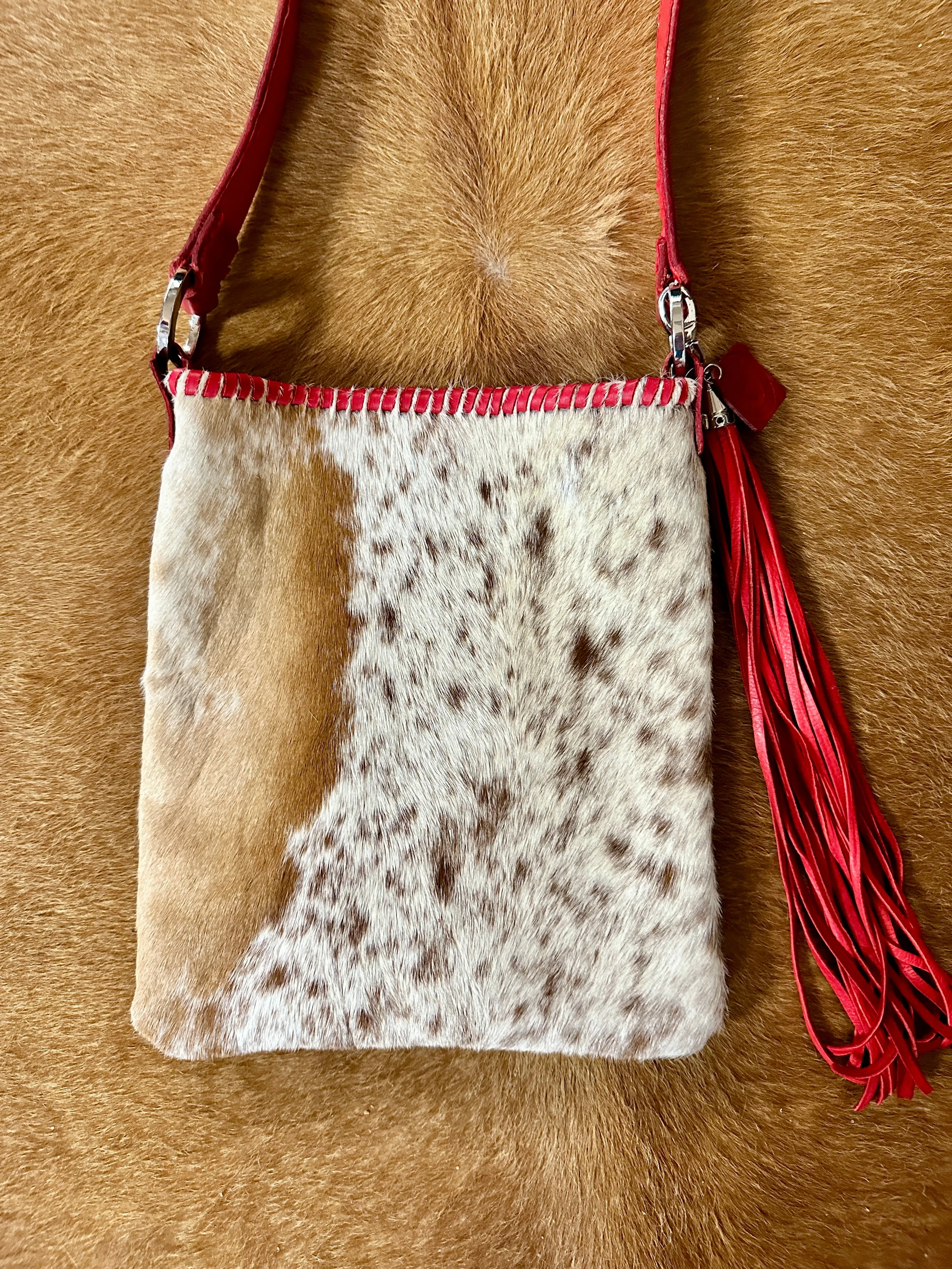 Hand Made Cowhide and Red Leather Purse at Bourbon Cowgirl