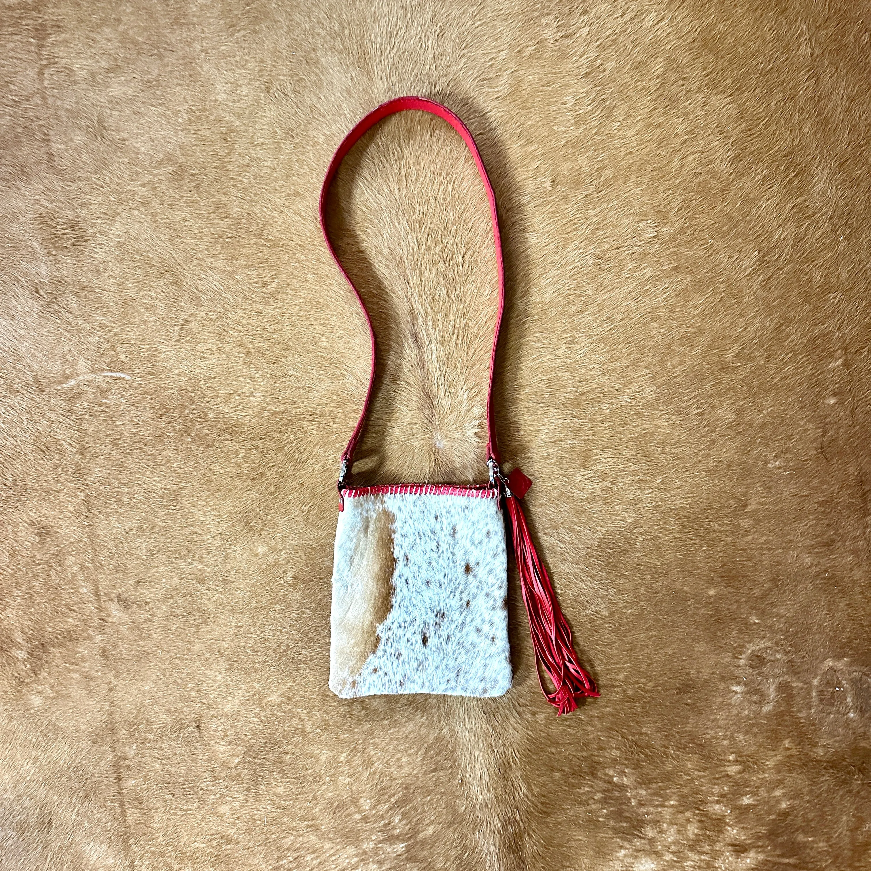 Hand Made Cowhide and Red Leather Purse at Bourbon Cowgirl