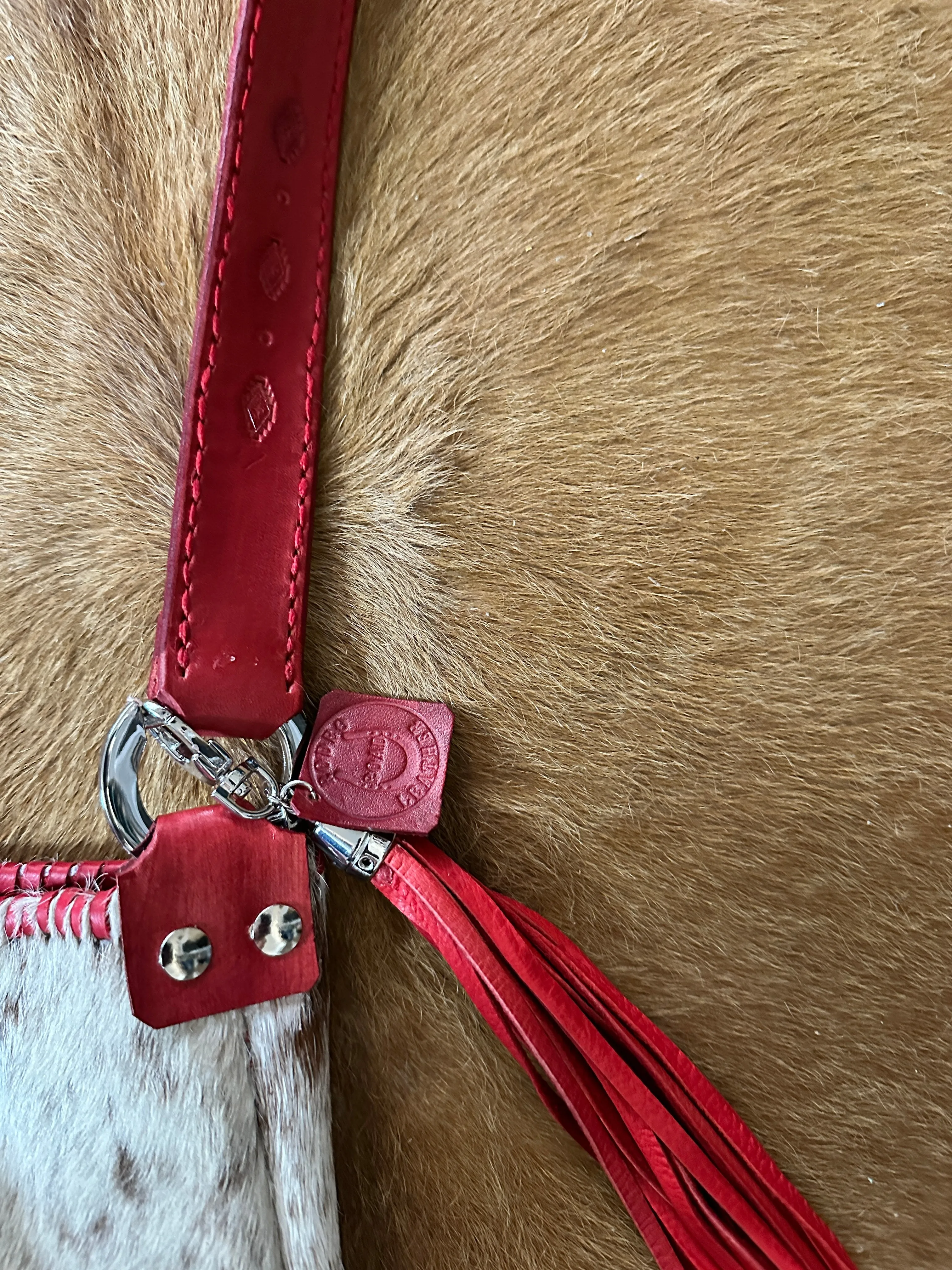 Hand Made Cowhide and Red Leather Purse at Bourbon Cowgirl