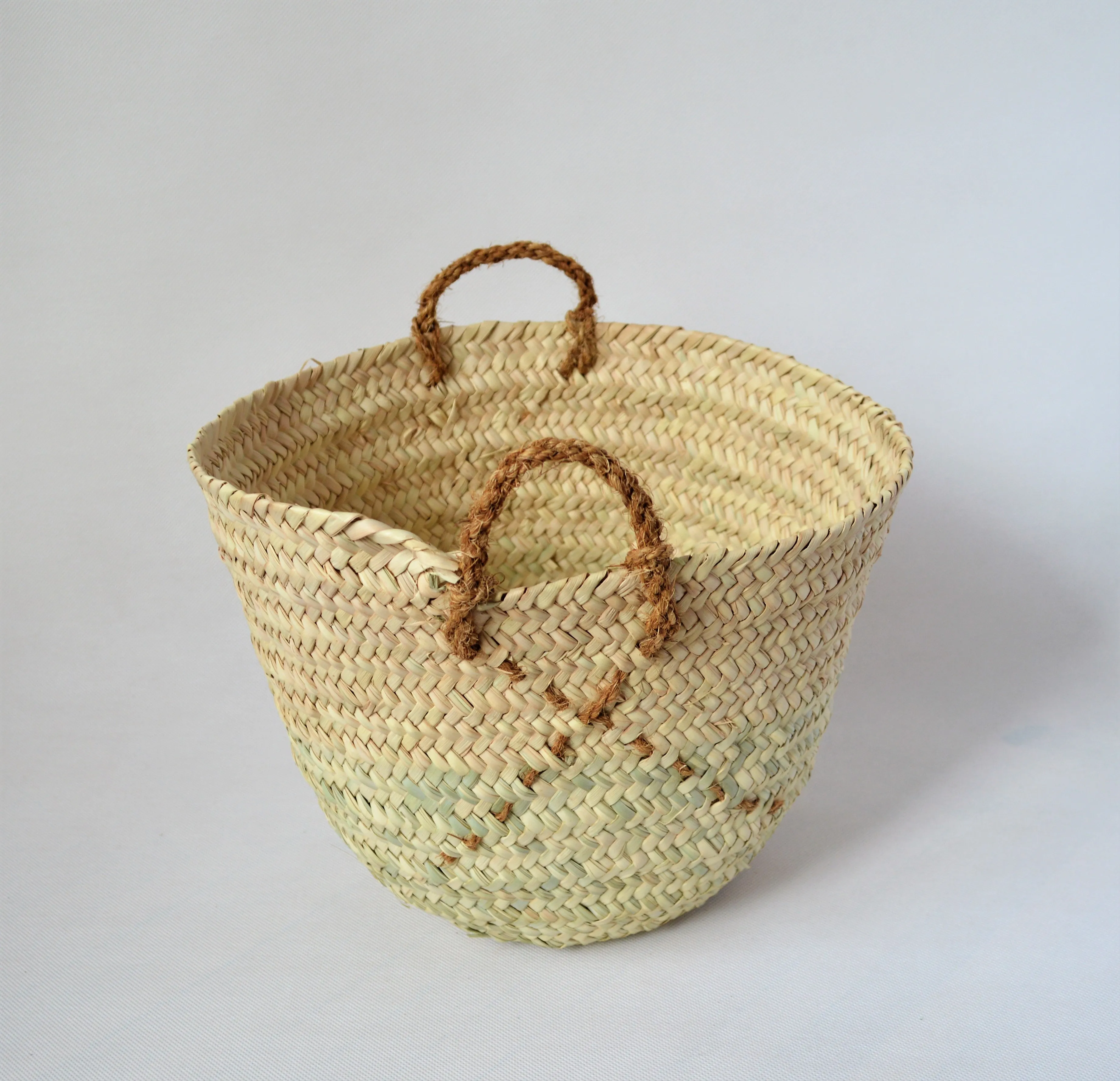 Natural palm straw basket with a strong natural handle from palm tree fibers